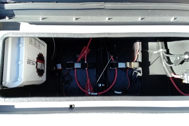 Slide: The Image of Battery compartment of 2026 Thor 1900 Lake Hammer with cables and connections. - 26