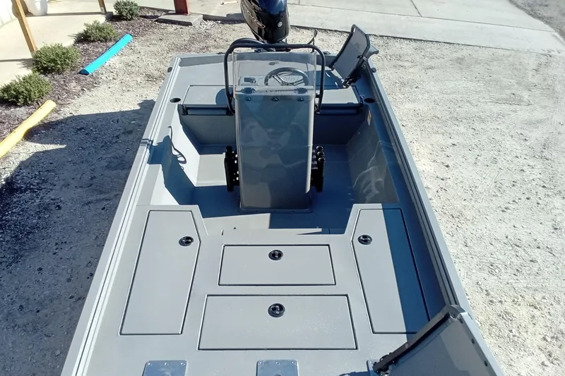 Slide: The Image of 2026 Thor 1900 Lake Hammer boat interior with storage compartments and steering console. - 27