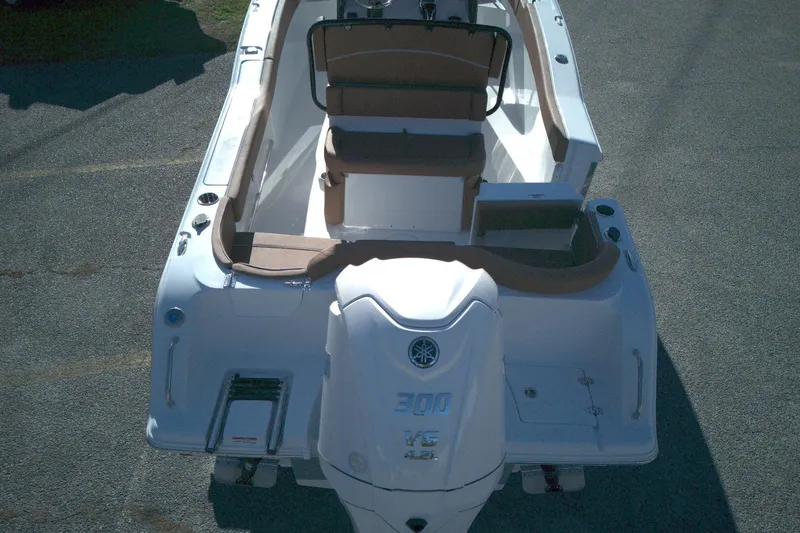 Slide: The Image of 2026 Sea Hunt Ultra 245 SE boat with Yamaha 300 engine, rear view. - 2