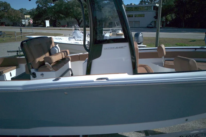 Slide: The Image of 2026 Sea Hunt Ultra 245 SE boat with sleek design and comfortable seating. - 6