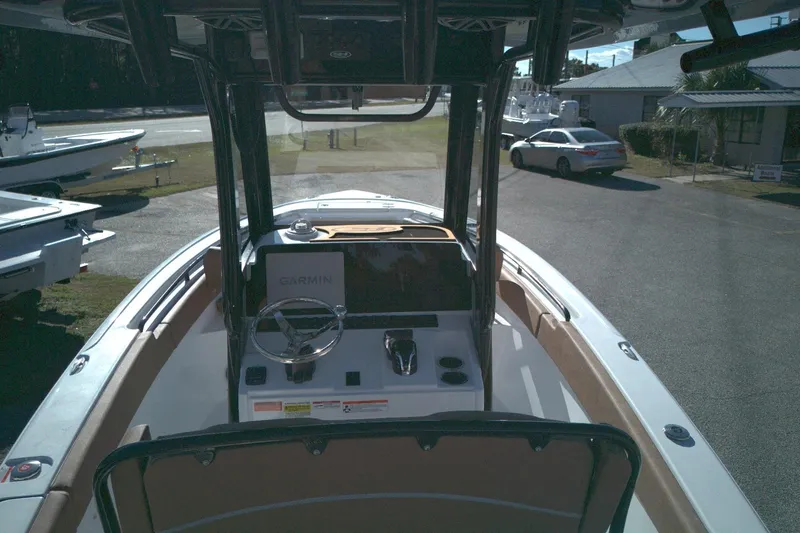 Slide: The Image of 2026 Sea Hunt Ultra 245 SE boat interior with Garmin navigation system. - 7