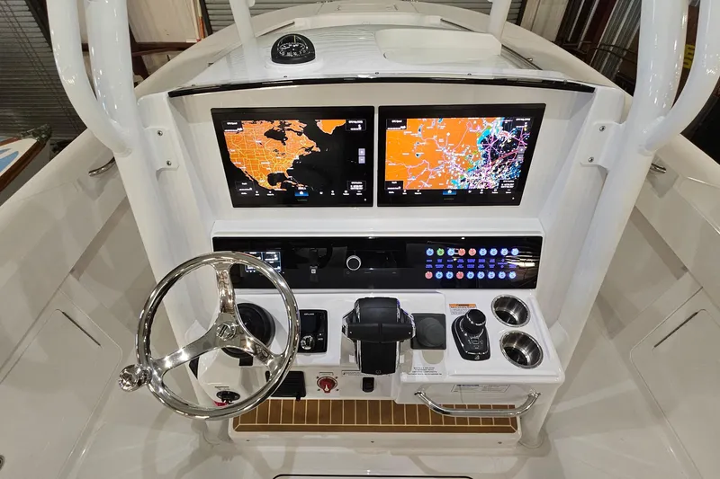 Slide: The Image of 2026 Southport 30 FE boat cockpit with advanced navigation system and sleek design. - 15
