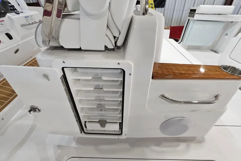Slide: The Image of 2026 Southport 30 FE boat interior with advanced navigation system and seating. - 21