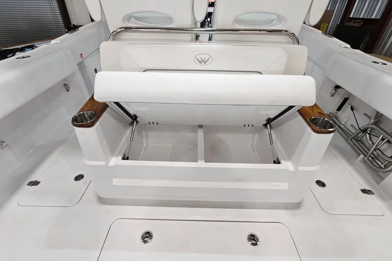 Slide: The Image of 2026 Southport 30 FE boat interior with white seating and wood accents. - 23