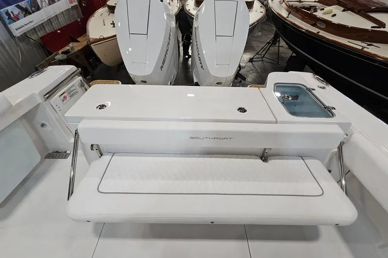 Slide: The Image of 2026 Southport 30 FE boat interior with seating and twin Mercury engines. - 25