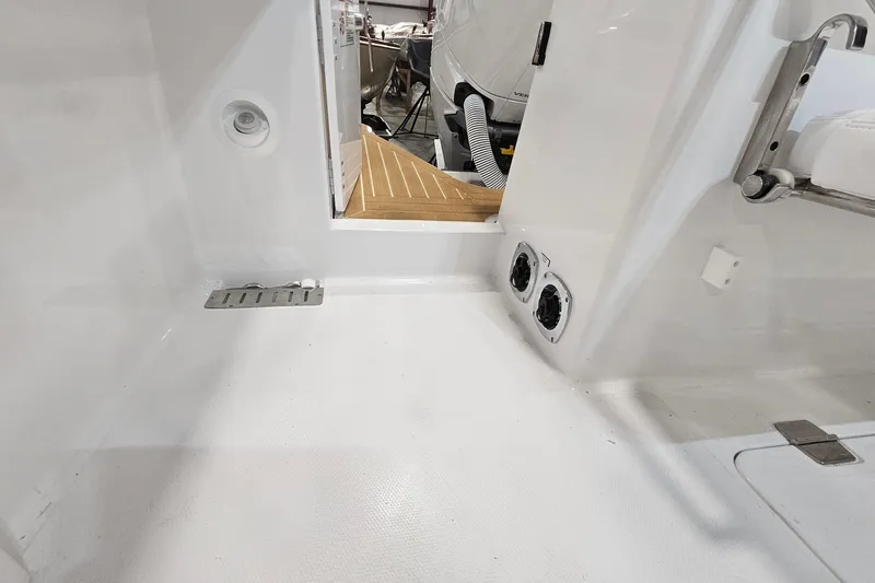 Slide: The Image of Open storage compartment on 2026 Southport 30 FE boat, showcasing spacious interior design. - 29