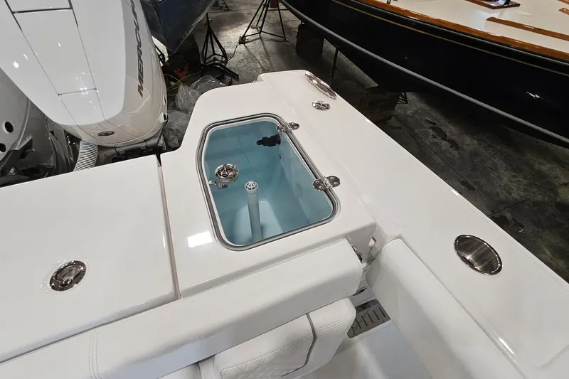 Slide: The Image of Interior view of 2026 Southport 30 FE boat, showcasing clean white deck and fittings. - 30