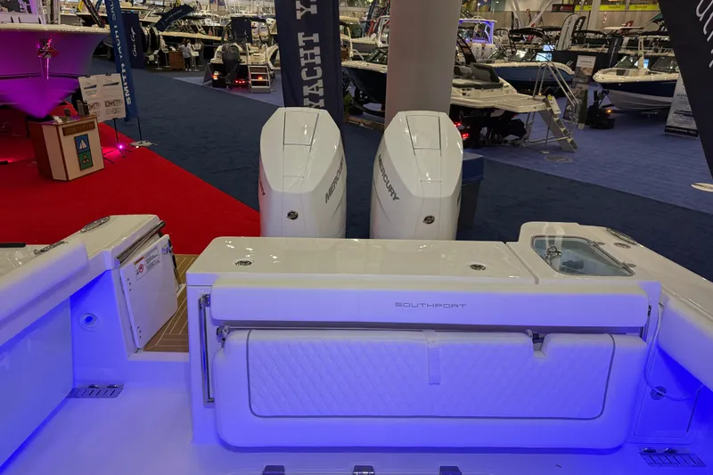 Slide: The Image of 2026 Southport 30 FE boat interior with modern controls and seating. - 9