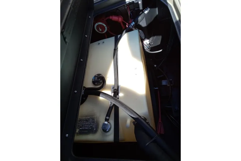 Slide: The Image of Engine compartment of 2026 Thor 1900 Lake Hammer, showcasing internal components and wiring. - 13