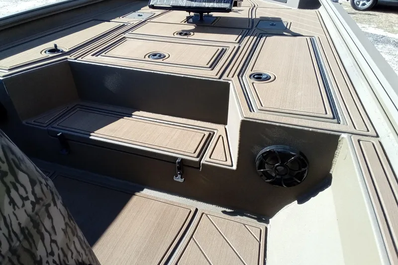 Slide: The Image of 2026 Thor 1900 Lake Hammer boat interior with storage compartments and speaker. - 17