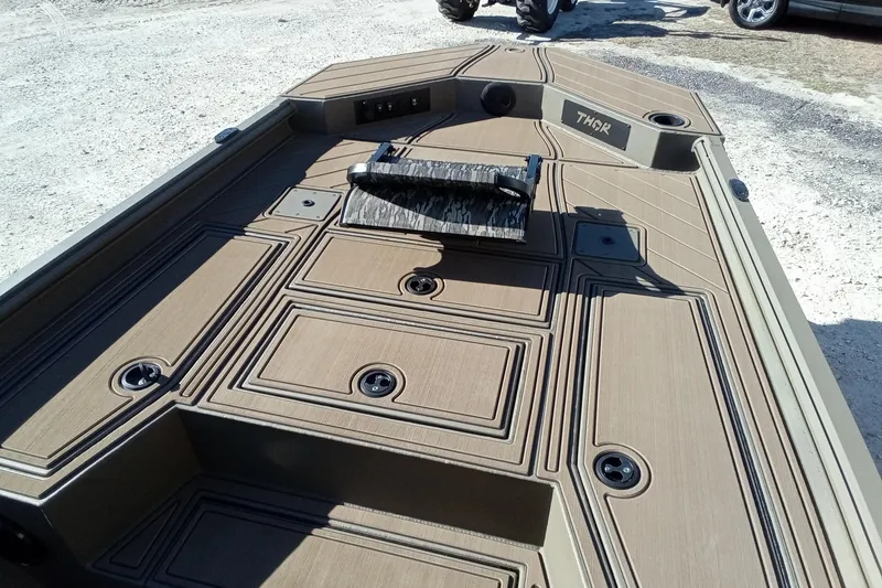 Slide: The Image of 2026 Thor 1900 Lake Hammer boat deck with storage compartments and sleek design. - 19