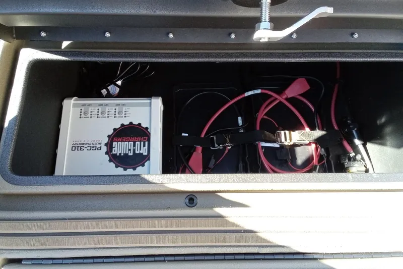 Slide: The Image of Battery compartment of 2026 Thor 1900 Lake Hammer with Pro Guide charger and cables. - 22