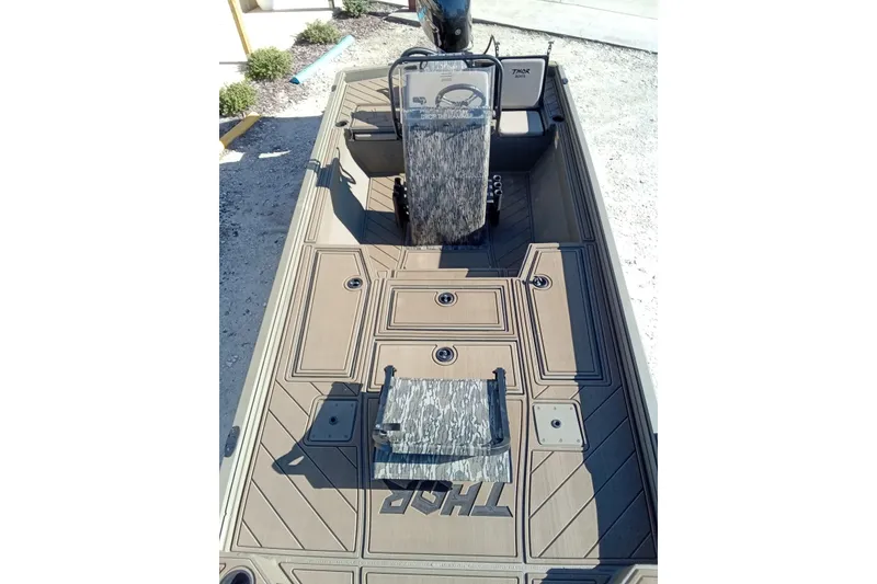 Slide: The Image of Thor 1900 Lake Hammer 2026 boat interior with seating and storage compartments. - 25