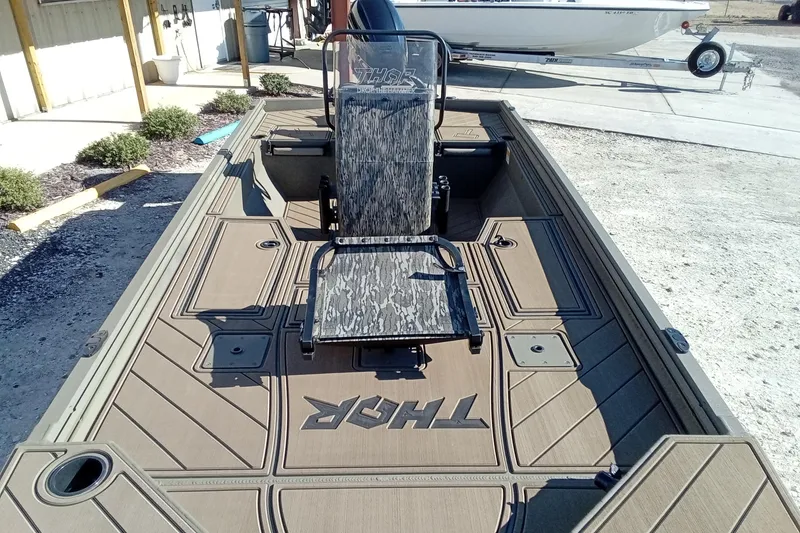 Slide: The Image of 2026 Thor 1900 Lake Hammer boat with camo seating and spacious deck. - 8