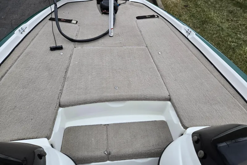 Slide: The Image of 2008 Nitro Z-6 boat deck with carpeted surface and fishing equipment. - 14