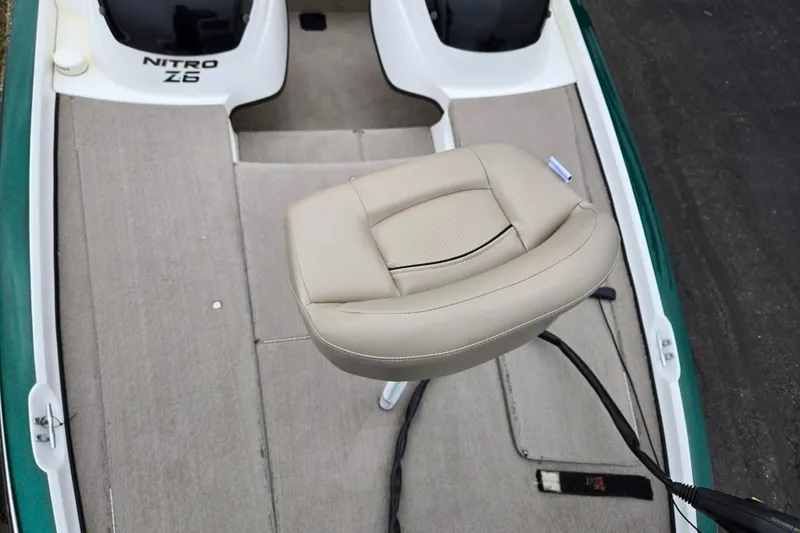 Slide: The Image of 2008 Nitro Z-6 boat interior with beige seat and carpeted deck. - 17