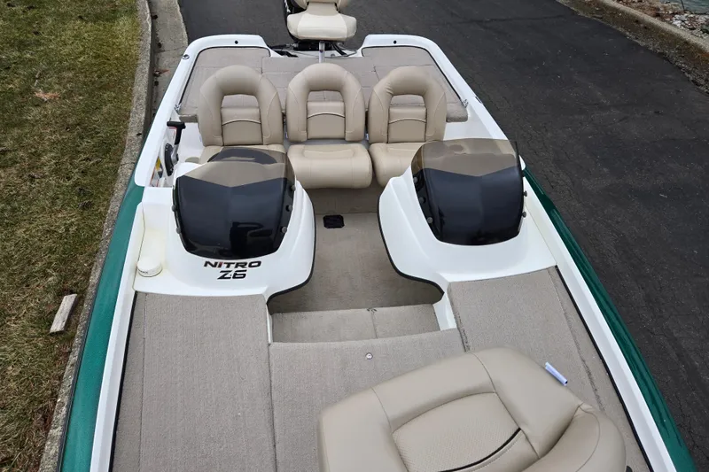 Slide: The Image of 2008 Nitro Z-6 boat interior with beige seating and dual consoles. - 18