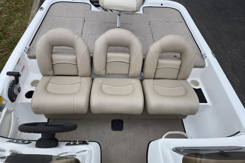 Slide: The Image of 2008 Nitro Z-6 boat interior with beige seating and steering wheel. - 19