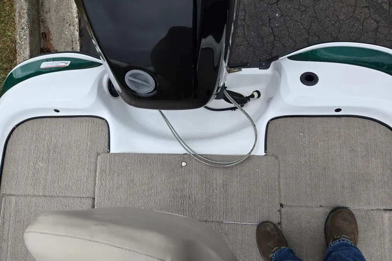 Slide: The Image of Interior view of a 2008 Nitro Z-6 boat deck with carpet and control panel. - 21