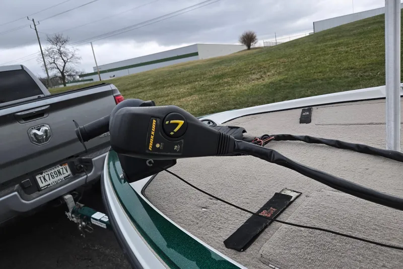 Slide: The Image of Boat with trolling motor on a 2008 Nitro Z-6, parked near a truck. - 5