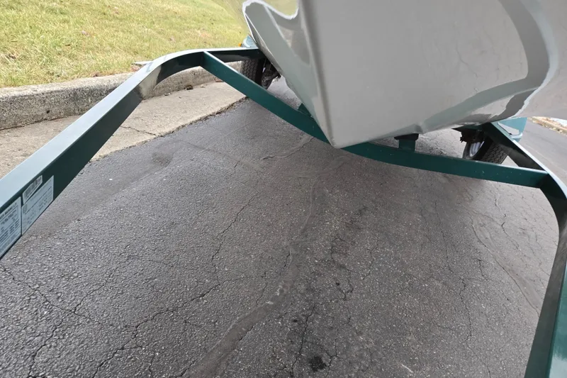 Slide: The Image of 2008 Nitro Z-6 boat on trailer, parked on asphalt near grass. - 8