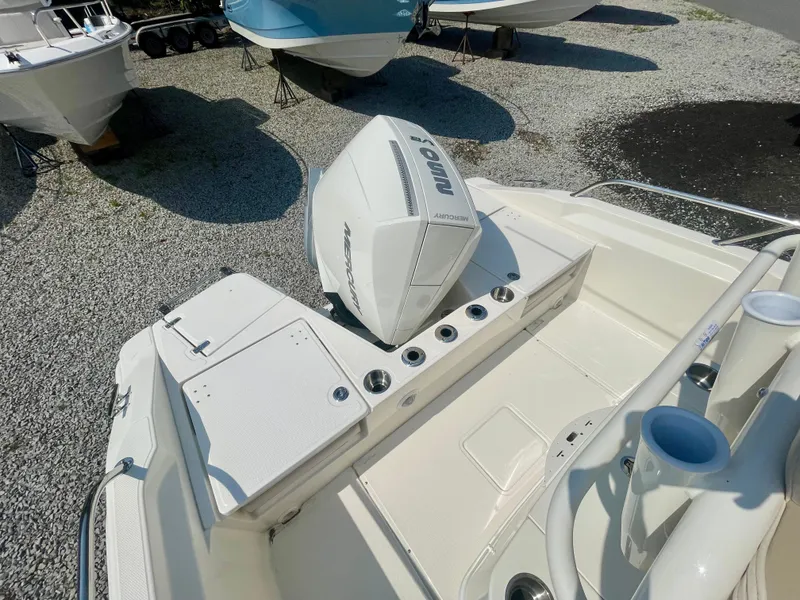 Slide: The Image of The image shows the stern of a Boston Whaler 220 Dauntless with an outboard motor. - 2