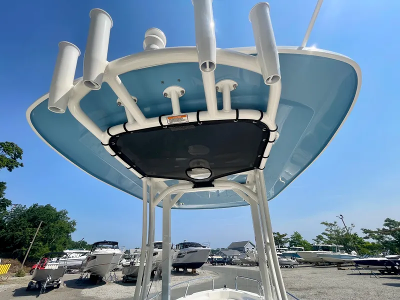 Slide: The Image of View of a Boston Whaler 220 Dauntless T-top with multiple fishing rod holders. - 7