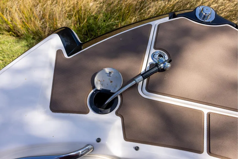 Slide: The Image of Fuel cap and hose on 2018 Chaparral 264 Sunesta boat deck. - 14