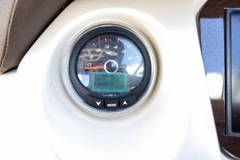 Slide: The Image of Close-up of 2018 Chaparral 264 Sunesta tachometer displaying engine hours. - 16