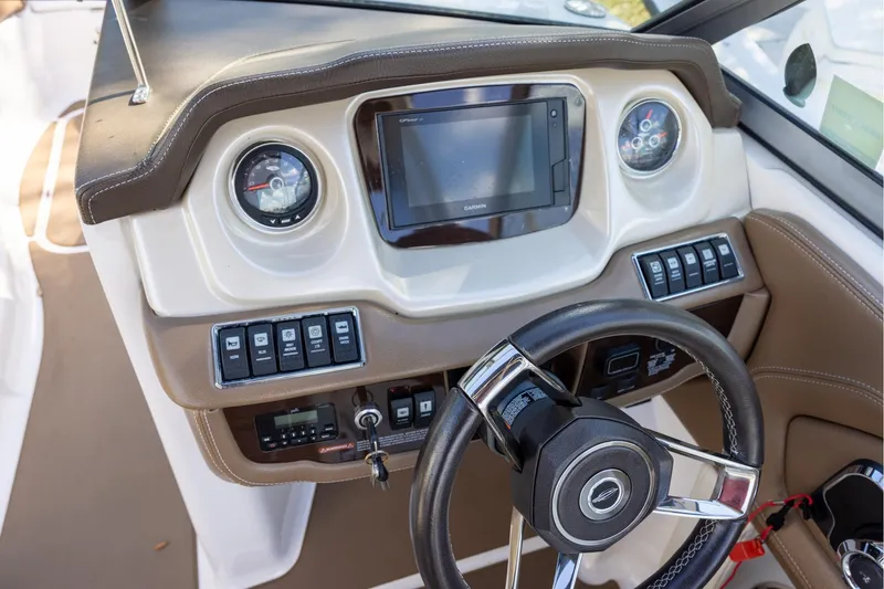 Slide: The Image of Steering console of 2018 Chaparral 264 Sunesta boat with modern controls and gauges. - 7