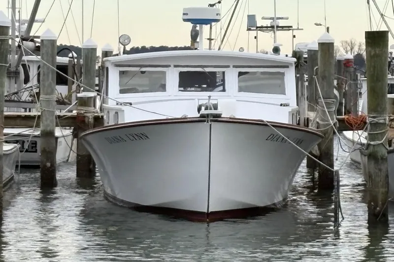 The Image of 1979 Custom Chesapeake Sportfish Cruiser docked at marina, front view. - 1