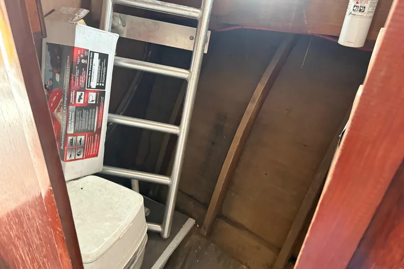 Slide: The Image of Interior of 1979 Custom Chesapeake Sportfish Cruiser with ladder and fire extinguisher box. - 12