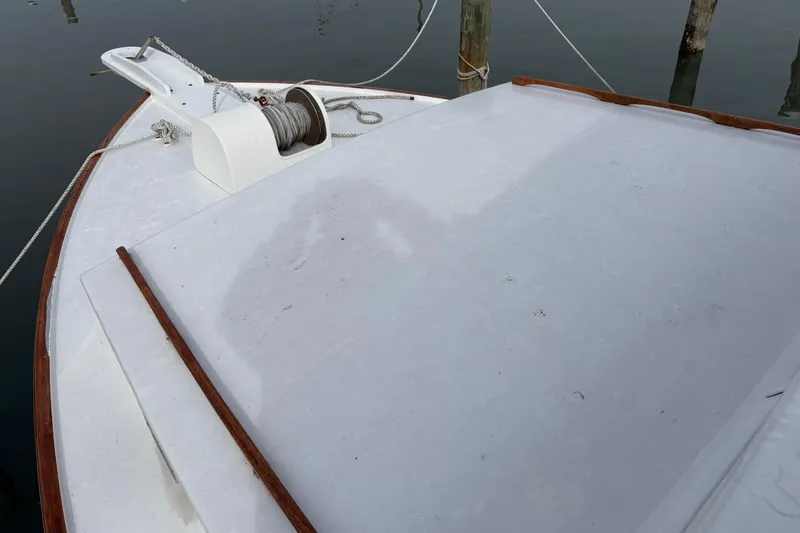 Slide: The Image of 1979 Custom Chesapeake Sportfish Cruiser deck with winch and ropes. - 6