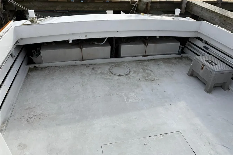 Slide: The Image of 1979 Custom Chesapeake Sportfish Cruiser deck with storage compartments and seating. - 7