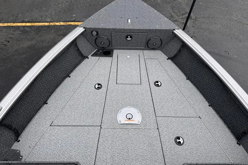 Slide: The Image of 2026 Lund 1775 Impact XS Sport boat deck with storage compartments and speakers. - 13