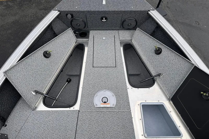 Slide: The Image of 2026 Lund 1775 Impact XS Sport boat interior with open storage compartments. - 14