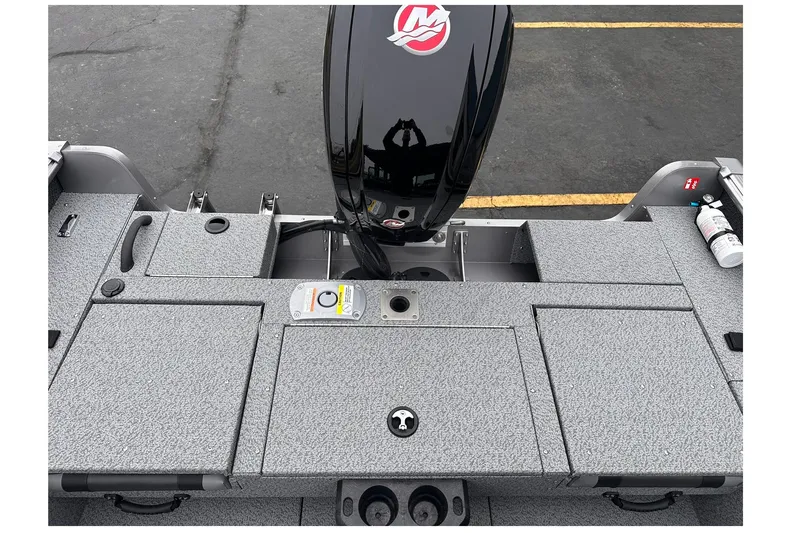 Slide: The Image of 2026 Lund 1775 Impact XS Sport boat deck with motor and storage compartments. - 17