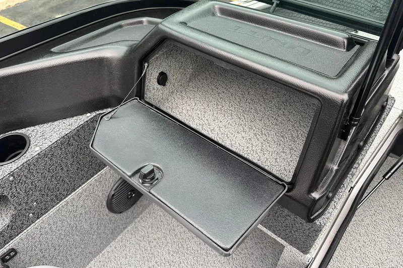 Slide: The Image of 2026 Lund 1775 Impact XS Sport boat interior with open storage compartment. - 18
