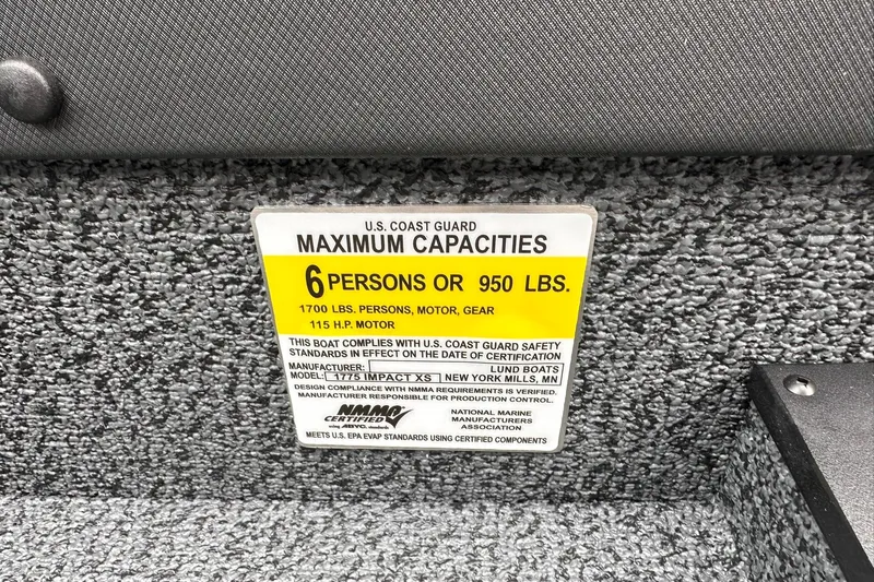 Slide: The Image of 2026 Lund 1775 Impact XS Sport capacity label, 6 persons or 950 lbs, U.S. Coast Guard compliant. - 25
