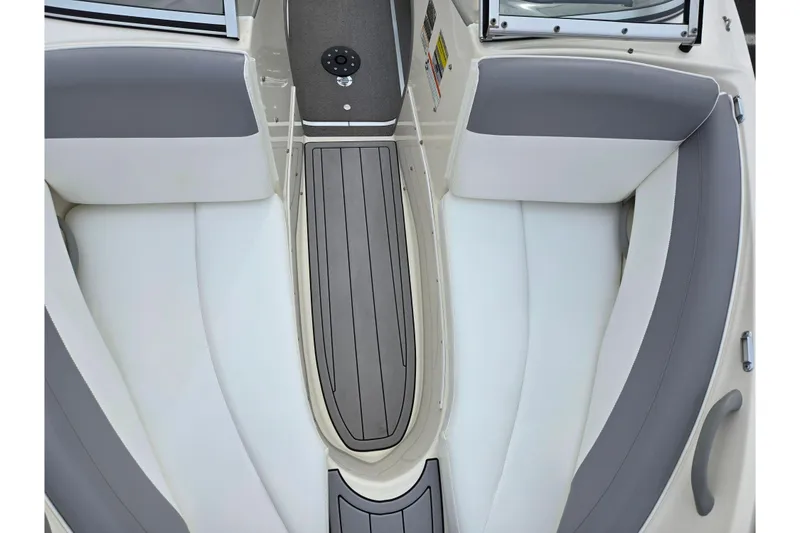 Slide: The Image of Interior view of a 2010 Bayliner 185 boat with gray and white seating. - 18