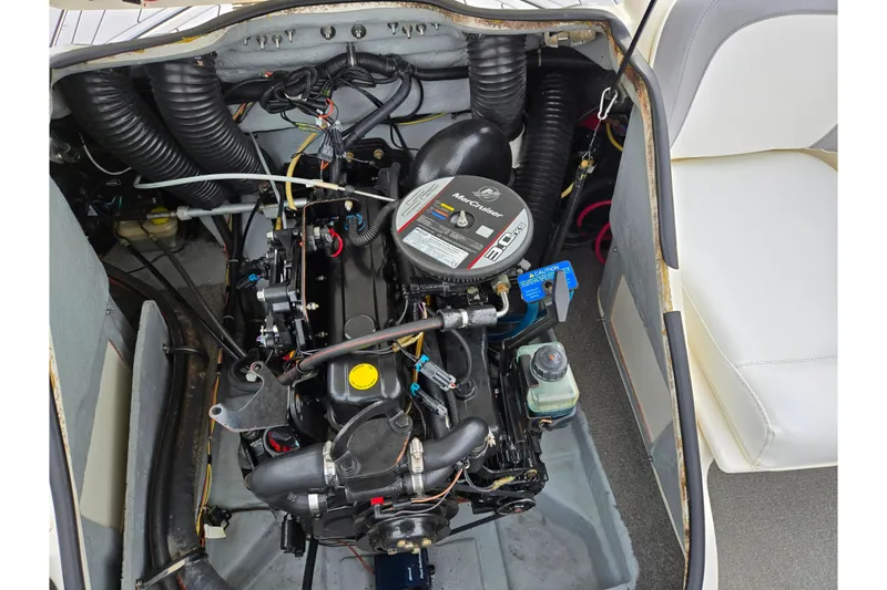 Slide: The Image of Engine compartment of a 2010 Bayliner 185 boat, showcasing the MerCruiser engine. - 22