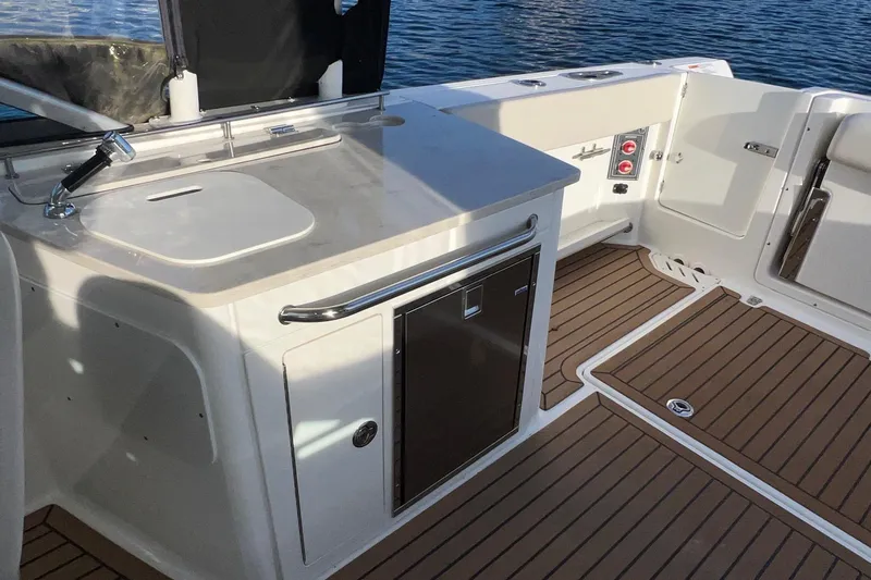 Slide: The Image of 2019 Boston Whaler 270 Vantage boat interior with sleek design and modern amenities. - 11