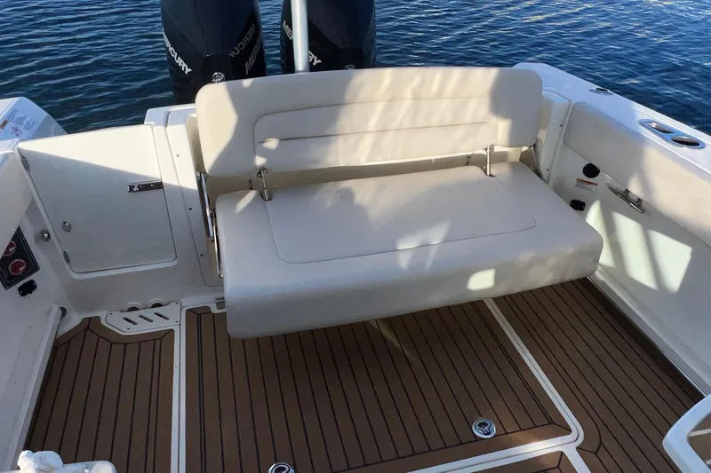 Slide: The Image of 2019 Boston Whaler 270 Vantage boat interior with foldable seating and teak flooring. - 21