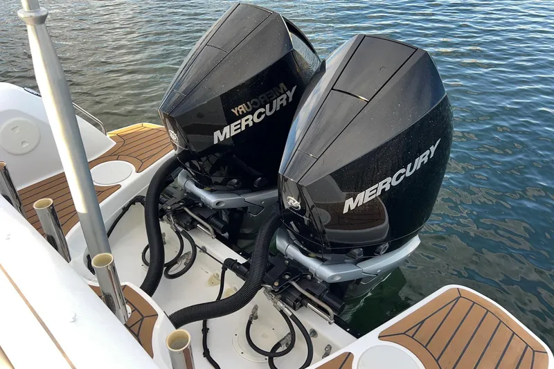 Slide: The Image of Twin Mercury outboard engines on a 2019 Boston Whaler 270 Vantage boat. - 22
