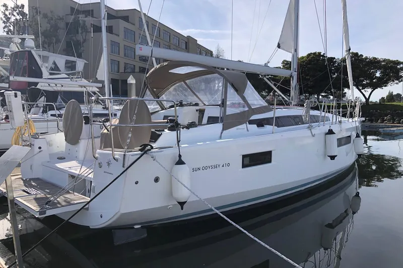 The Image of 2022 Jeanneau Sun Odyssey 410 sailboat docked in marina, side view. - 0