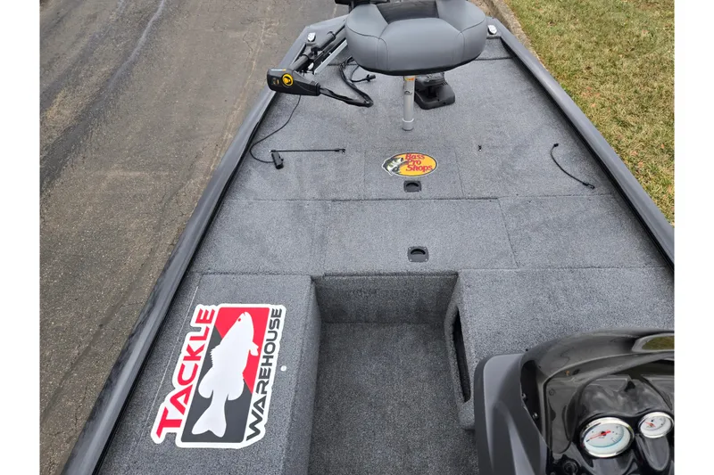 Slide: The Image of 2025 Tracker Pro 170 boat interior with Tackle Warehouse and Bass Pro Shops logos. - 13