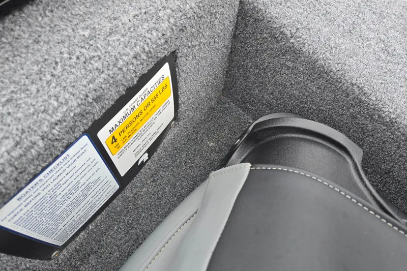 Slide: The Image of 2025 Tracker Pro 170 boat interior with capacity label and seat detail. - 20