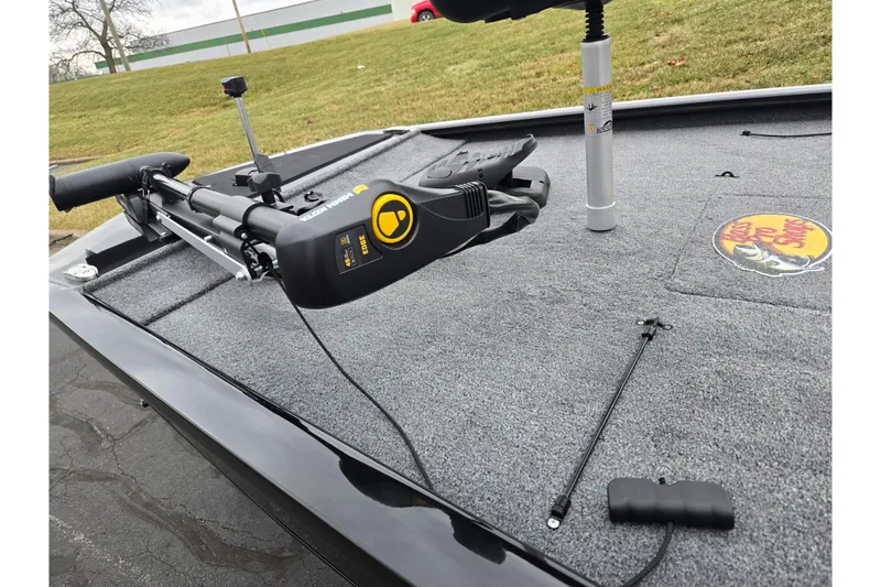 Slide: The Image of 2025 Tracker Pro 170 boat deck with trolling motor and Bass Pro Shops logo. - 5