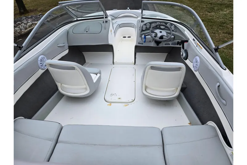 Slide: The Image of Interior of a 2011 Bayliner 195 boat with seating and steering wheel. - 10
