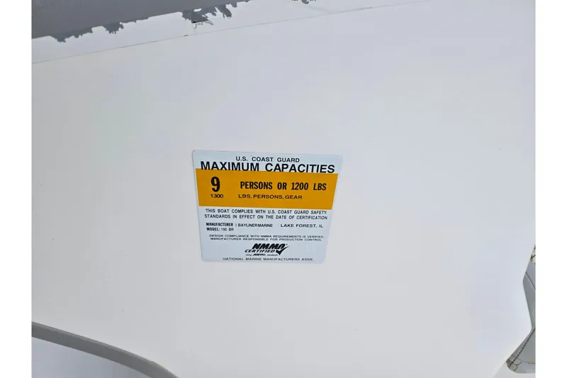 Slide: The Image of 2011 Bayliner 195 capacity label, maximum 9 persons or 1200 lbs, U.S. Coast Guard compliant. - 14